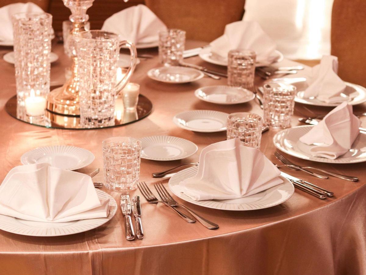 Moevenpick Hotel Du Lac Tunis Exterior photo A table set for fine dining